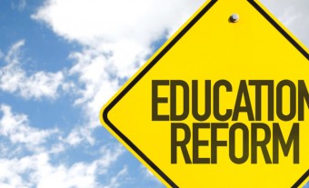 Education-Reform-sign-with-sky-background-e1526420222623